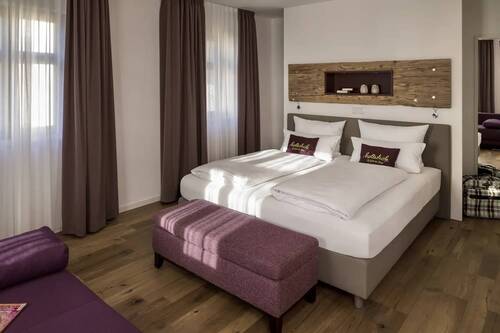 A bed in a Hollerhöfe holiday flat.
